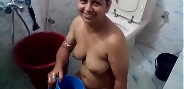  Curvy Bangla woman washing her hair and body